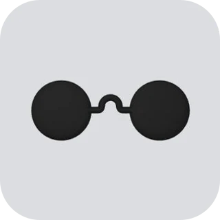 Round dark lenses joined by a thin bridge, on a pale gray tile